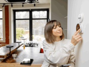 Woman enjoying benefits of a HVAC zone control system